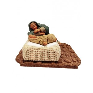 Donna sulla culla con...