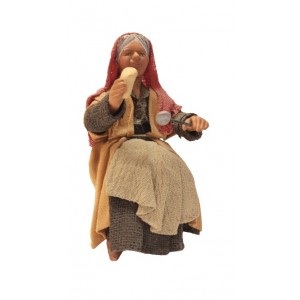 Donna seduta al tavolo cm...