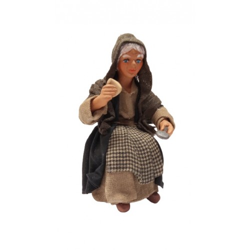 Donna seduta al tavolo senza sedia cm...