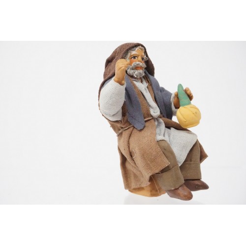 Uomo seduto con fiasco cm 10...