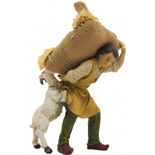 Pastore con sacco di paglia e capra h...