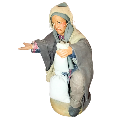 Uomo in ginocchio con sacchi cm 15...