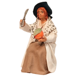 Donna seduta al tavolo cm...